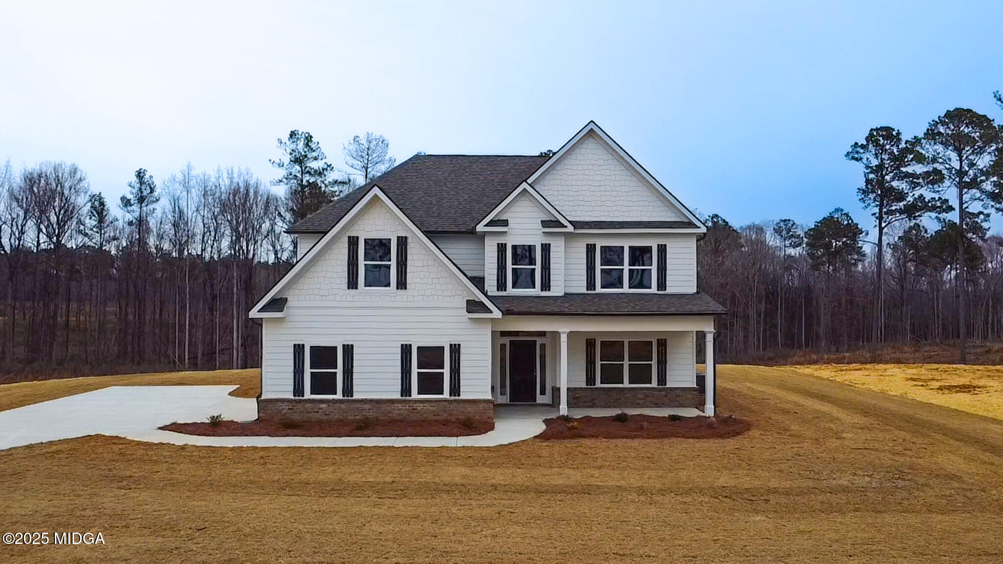 703 Giles Road Forsyth, GA 31029 - Photo 1 of 30 a front view of a house with a yard
