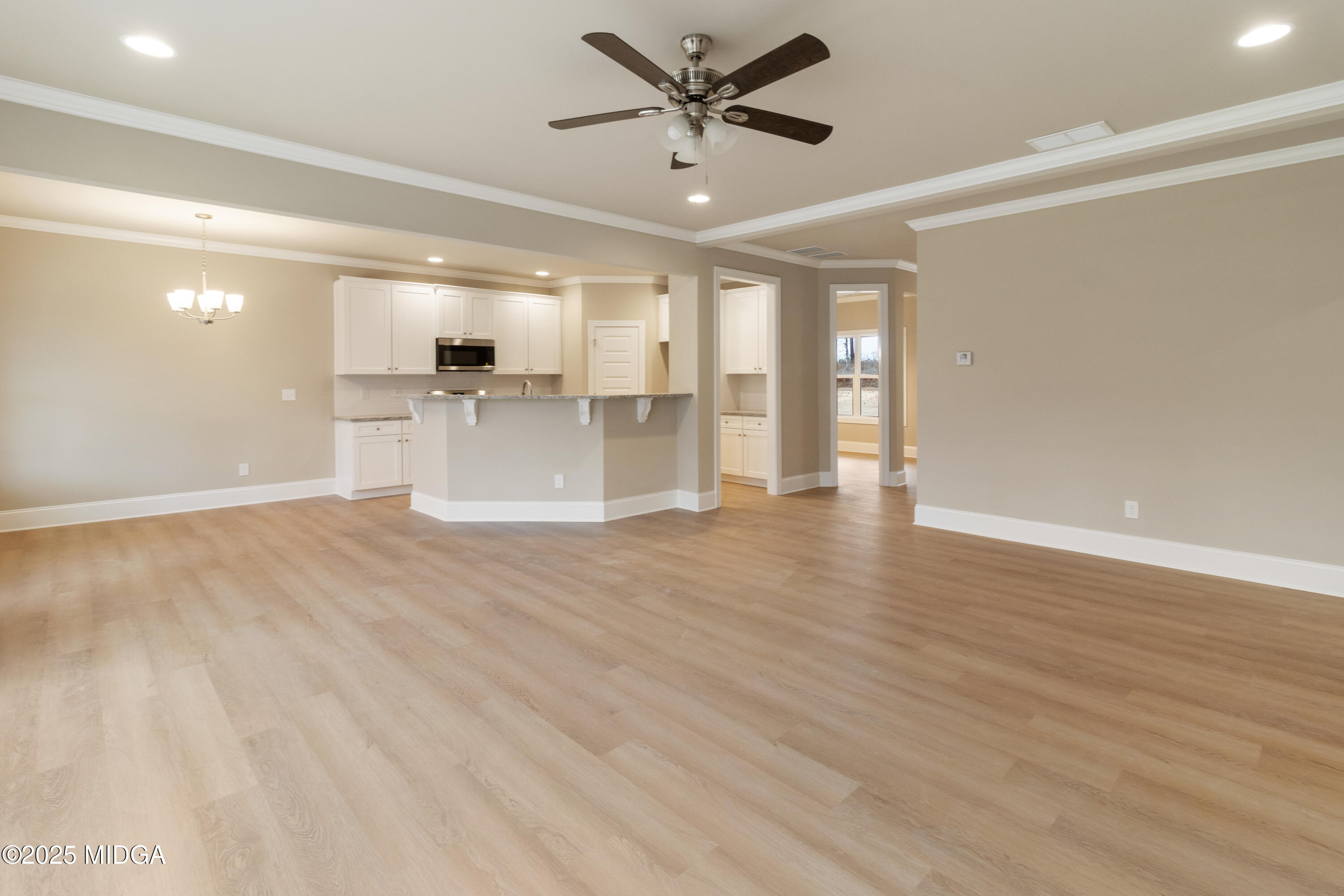 703 Giles Road Forsyth, GA 31029 - Photo 11 of 30 a view of a kitchen with a sink and microwave