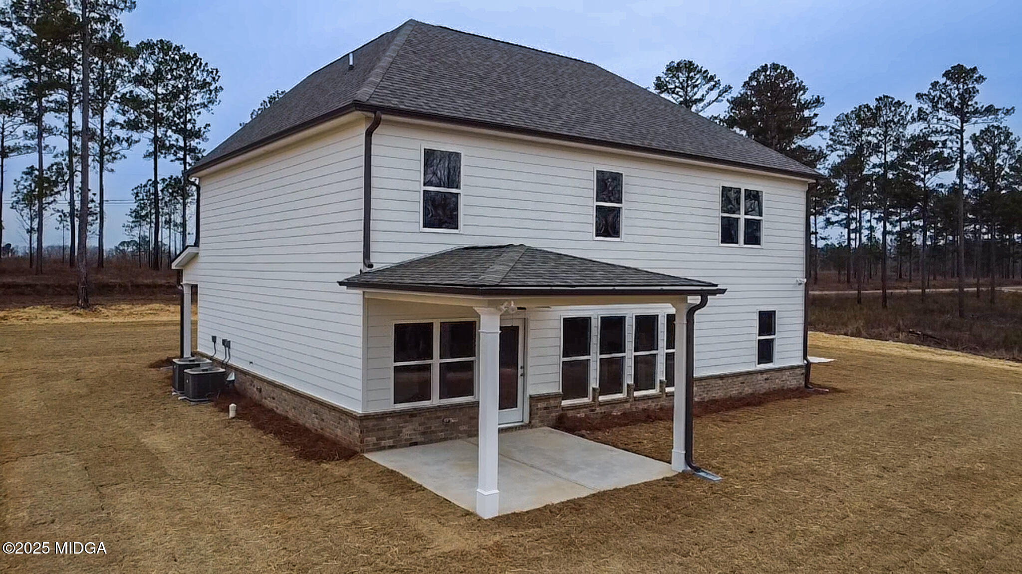 703 Giles Road Forsyth, GA 31029 - Photo 3 of 30 a front view of a house with a yard