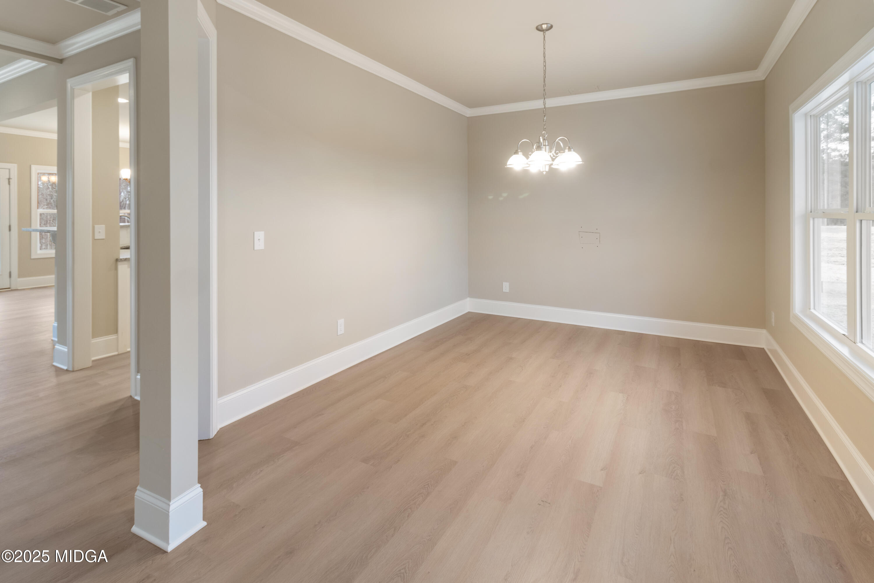 703 Giles Road Forsyth, GA 31029 - Photo 5 of 30 a view of a room with wooden floor and windows