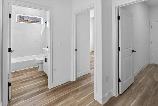 a bathroom with a tub and shower