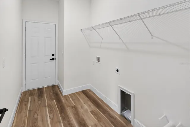 a view of room with wooden floor