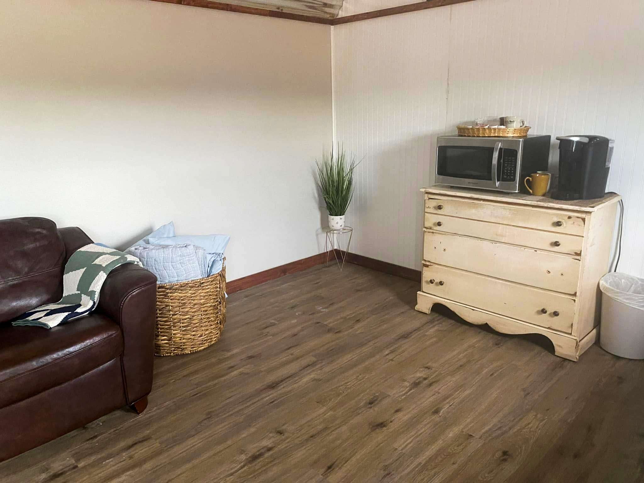 437 South Ore Road Westpoint, TN 38486 - Photo 19 of 58 a room with furniture and wooden floor