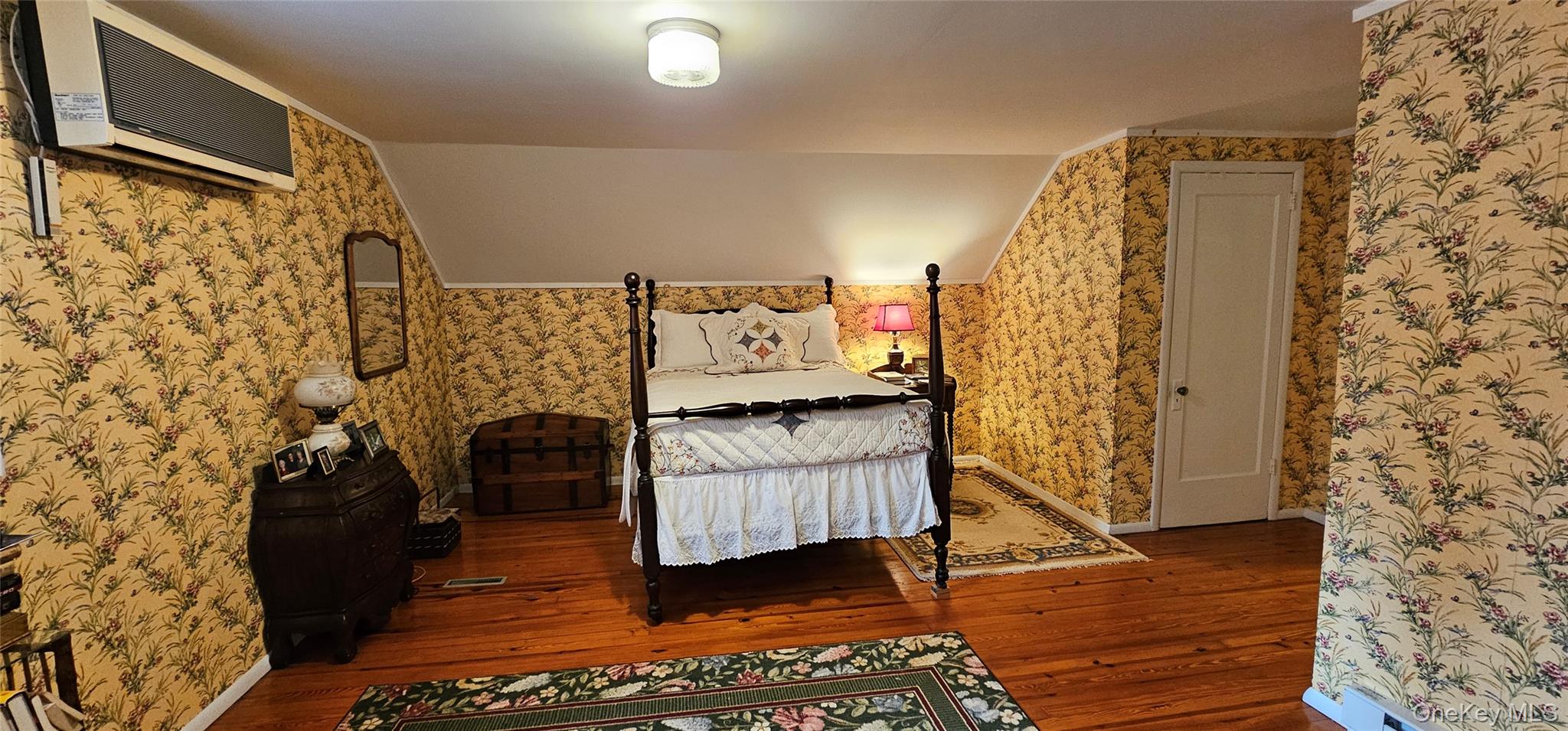 191 Eldred-Yulan Road Eldred, NY 12732 - Photo 21 of 34 a bedroom with a bed and a wooden floor