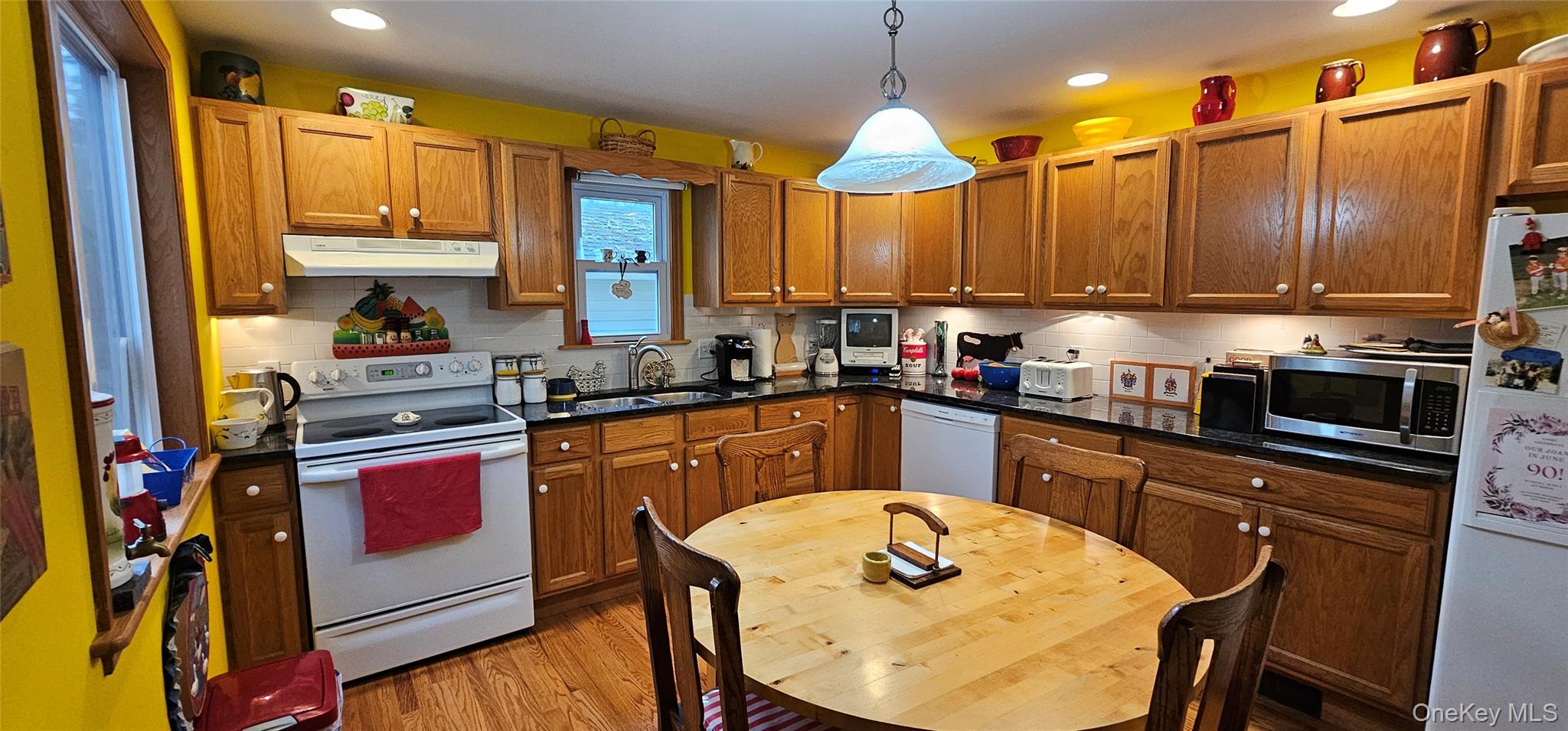 191 Eldred-Yulan Road Eldred, NY 12732 - Photo 7 of 34 a kitchen with stainless steel appliances granite countertop a sink a stove and a refrigerator