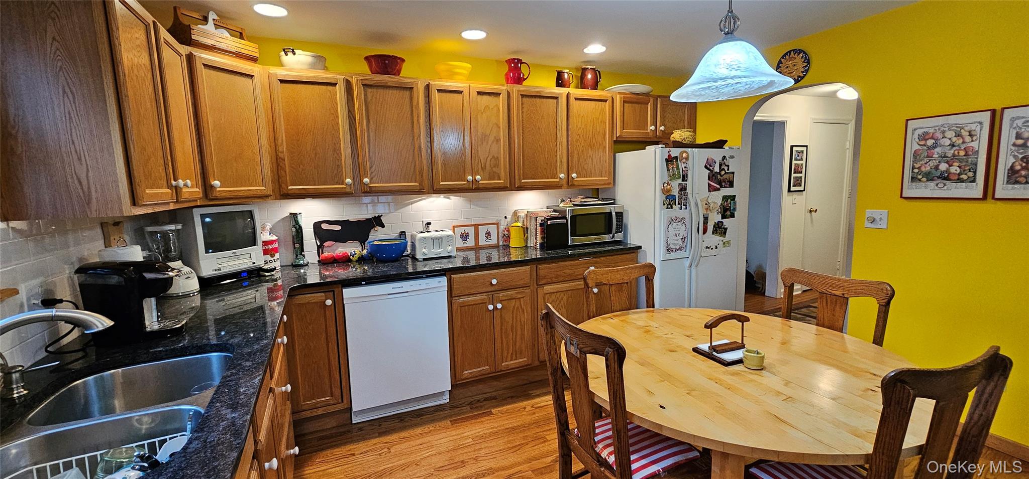 191 Eldred-Yulan Road Eldred, NY 12732 - Photo 8 of 34 a kitchen with a refrigerator a stove a sink and chairs
