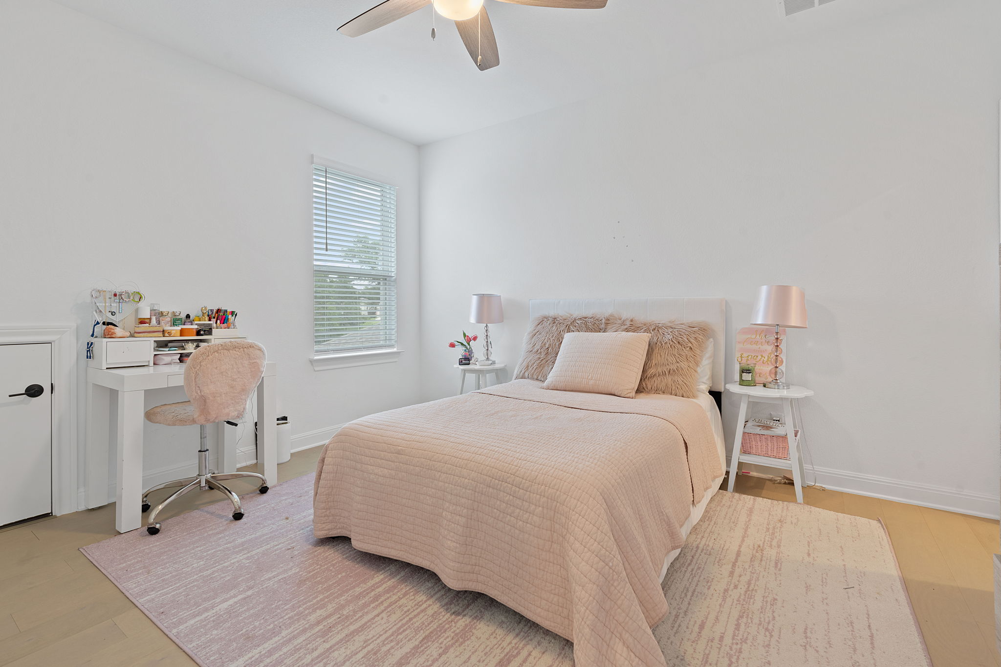 309 Pear Tree Lane Austin, TX 78737 - Photo 30 of 39 a bedroom with a bed and wooden floor