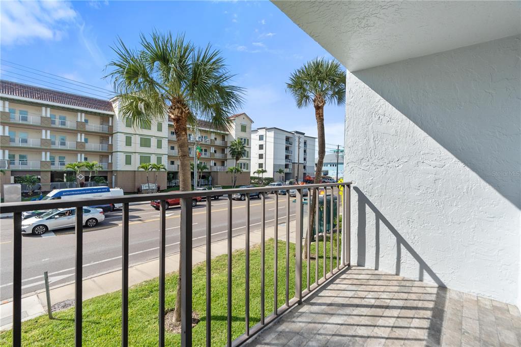 14001 Gulf Boulevard, Unit 201 Madeira Beach, FL 33708 - Photo 14 of 36 a view of a balcony with plants