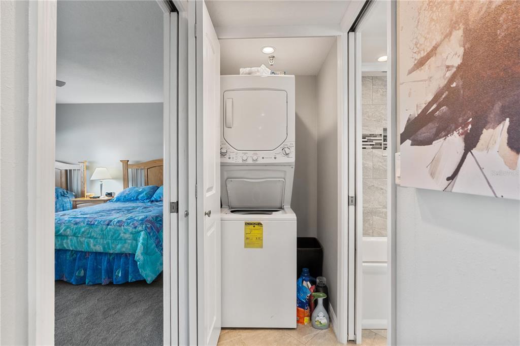 14001 Gulf Boulevard, Unit 201 Madeira Beach, FL 33708 - Photo 26 of 36 a bathroom with a sink and mirror