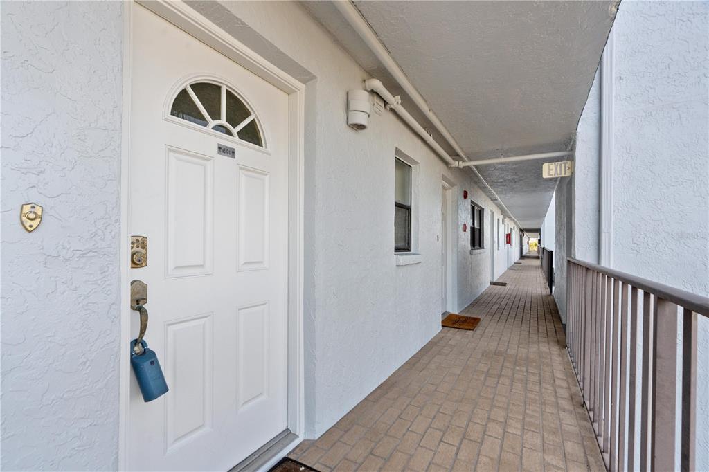14001 Gulf Boulevard, Unit 201 Madeira Beach, FL 33708 - Photo 3 of 36 a view of a hallway with stairs