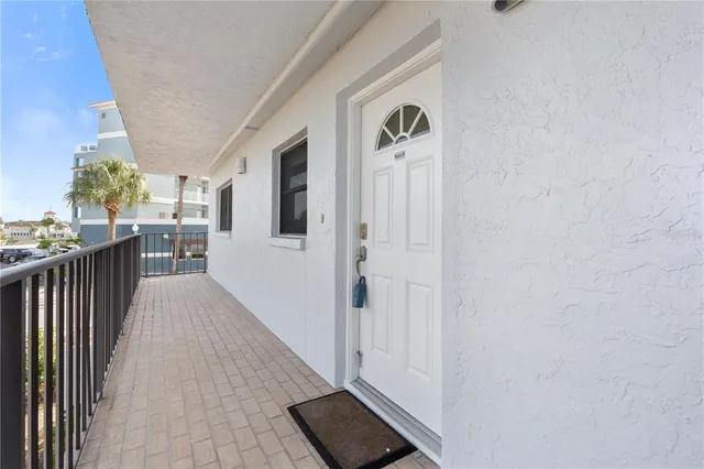 a view of a hallway with wooden floor and fence