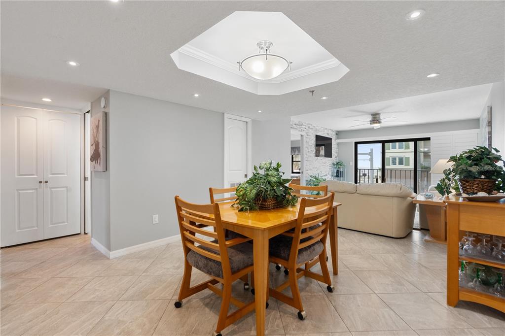 14001 Gulf Boulevard, Unit 201 Madeira Beach, FL 33708 - Photo 9 of 36 a dining room with furniture and window