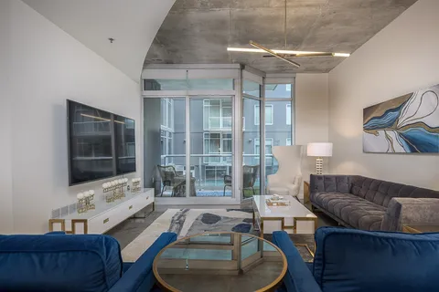 a living room with furniture and a flat screen tv