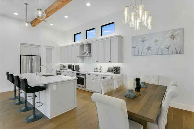 a view of kitchen with furniture and chandelier