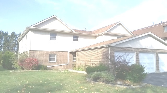 74 Terry Drive, Unit C Roselle, IL 60172 - Photo 1 of 1 a view front of house with a yard
