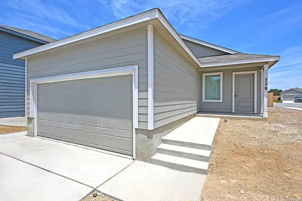 a front view of a house with a garage