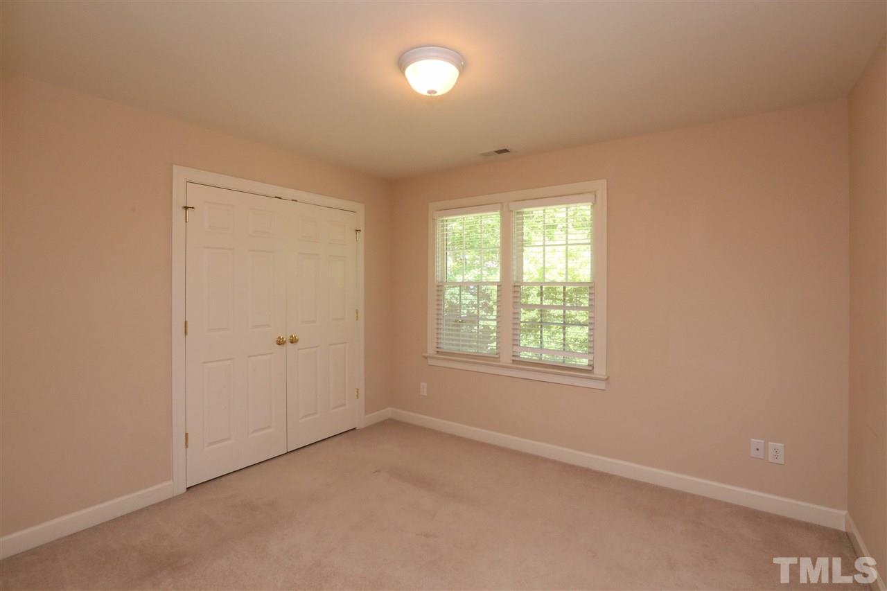 6729 Hammersmith Drive Raleigh, NC 27613 - Photo 12 of 21 an empty room with a window and a mirror