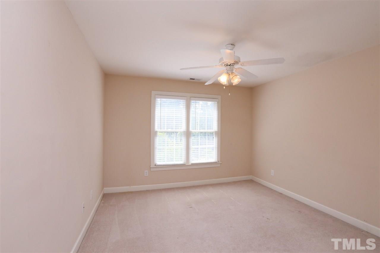 6729 Hammersmith Drive Raleigh, NC 27613 - Photo 14 of 21 an empty room with windows and fan