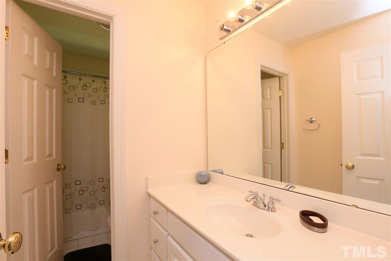6729 Hammersmith Drive Raleigh, NC 27613 - Photo 15 of 21 a bathroom with a sink and a mirror