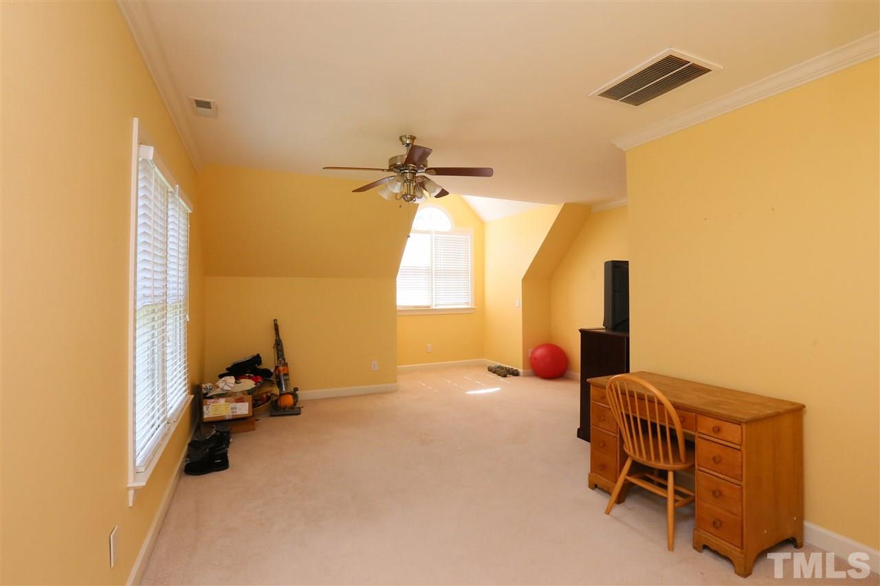 6729 Hammersmith Drive Raleigh, NC 27613 - Photo 17 of 21 a view of a livingroom with furniture and a ceiling fan