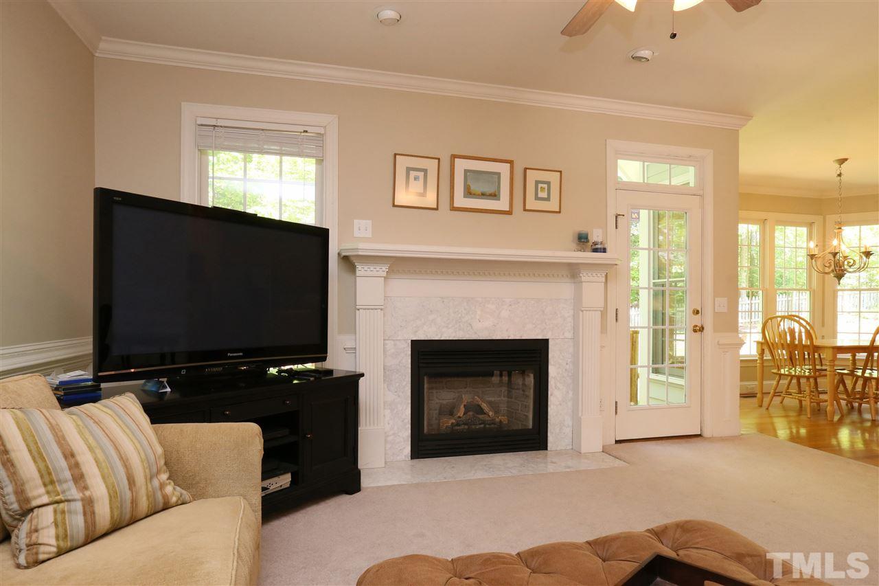 6729 Hammersmith Drive Raleigh, NC 27613 - Photo 5 of 21 a living room with furniture and a flat screen tv