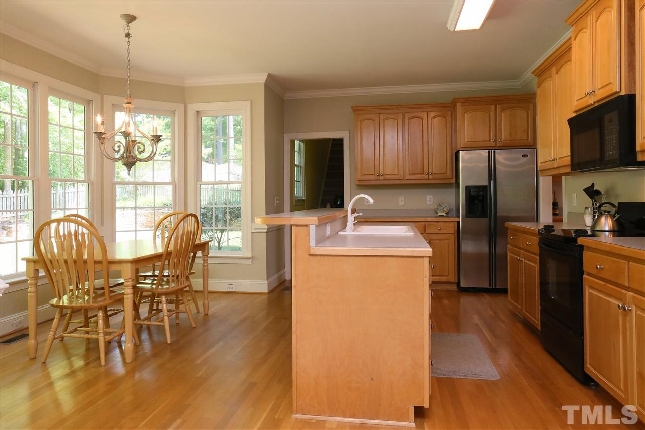 6729 Hammersmith Drive Raleigh, NC 27613 - Photo 6 of 21 a dining room with furniture window wooden floor