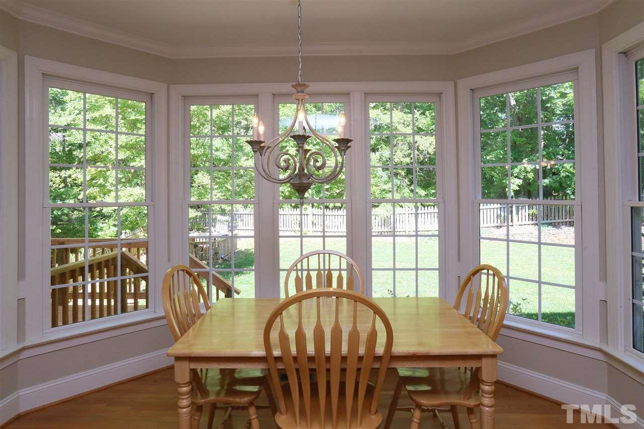 6729 Hammersmith Drive Raleigh, NC 27613 - Photo 9 of 21 a view of a dining room with furniture window and outside view