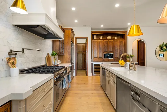 a kitchen with a table and chairs in it