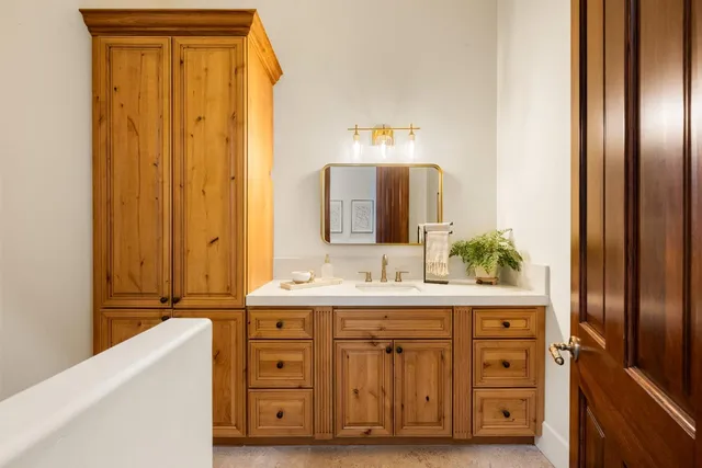 a view of a livingroom with a fireplace and window