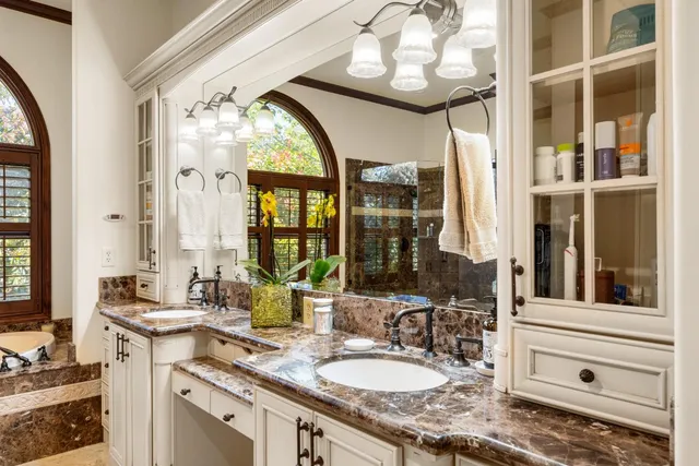 a bathroom with a bathtub and a shower