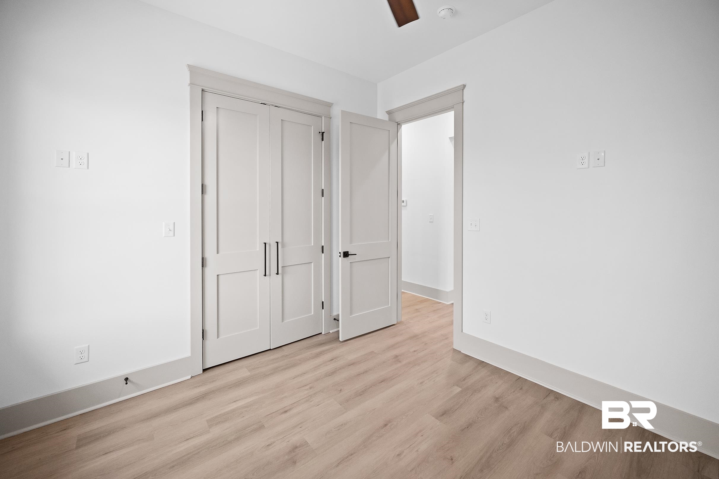 13111 Gopher Court Elberta, AL 36530 - Photo 32 of 41 Bright interior space featuring light wood-finish flooring, white walls, and white trim