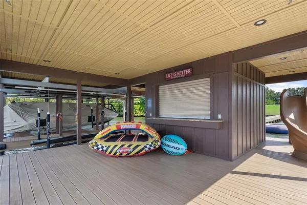 a view of a house with pool and a yard