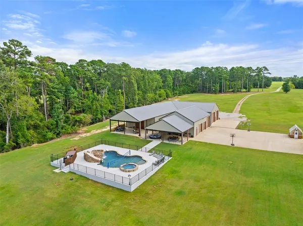 a view of a swimming pool with a yard