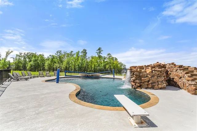 a kitchen with kitchen island granite countertop a sink stove and cabinets