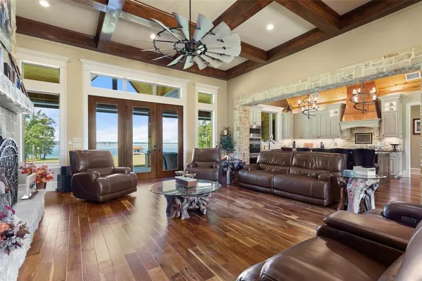 a large kitchen with a table and chairs