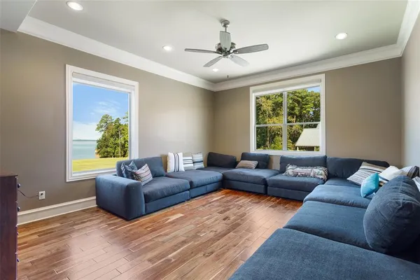 a outdoor space with lots of tables a large window and chairs