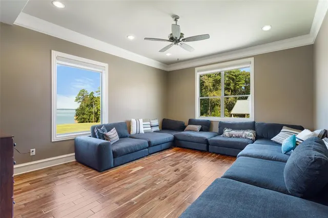 a outdoor space with lots of tables a large window and chairs