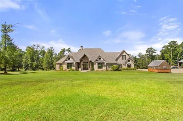 a view of a lake with a big yard