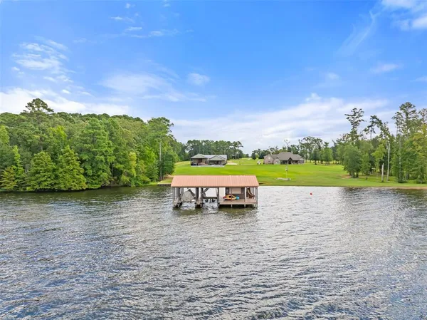 a view of swimming pool with outdoor seating