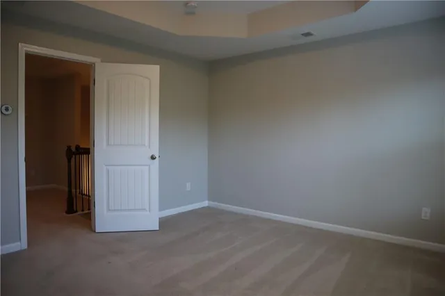 an empty room with closet area
