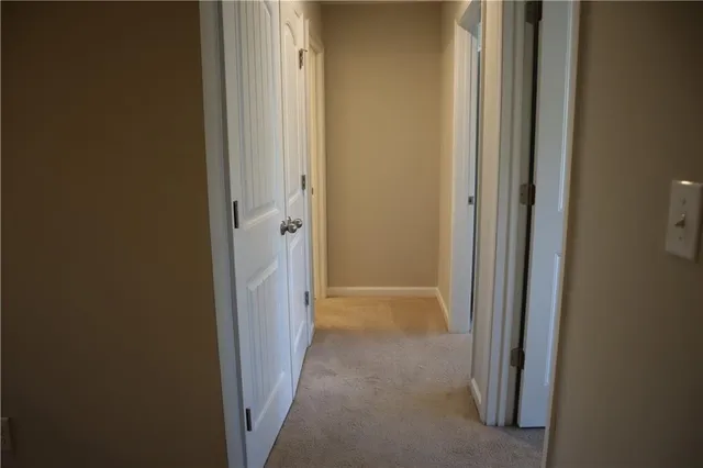 a view of a hallway with a door
