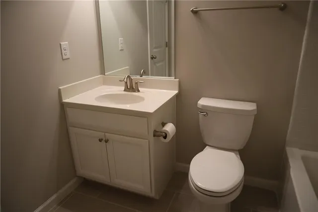 a view of a small space with wooden floor and a window