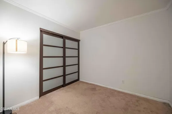 a view of a room with rack on the wall