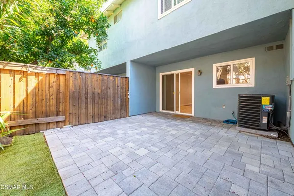 a view of backyard with tub and stairs