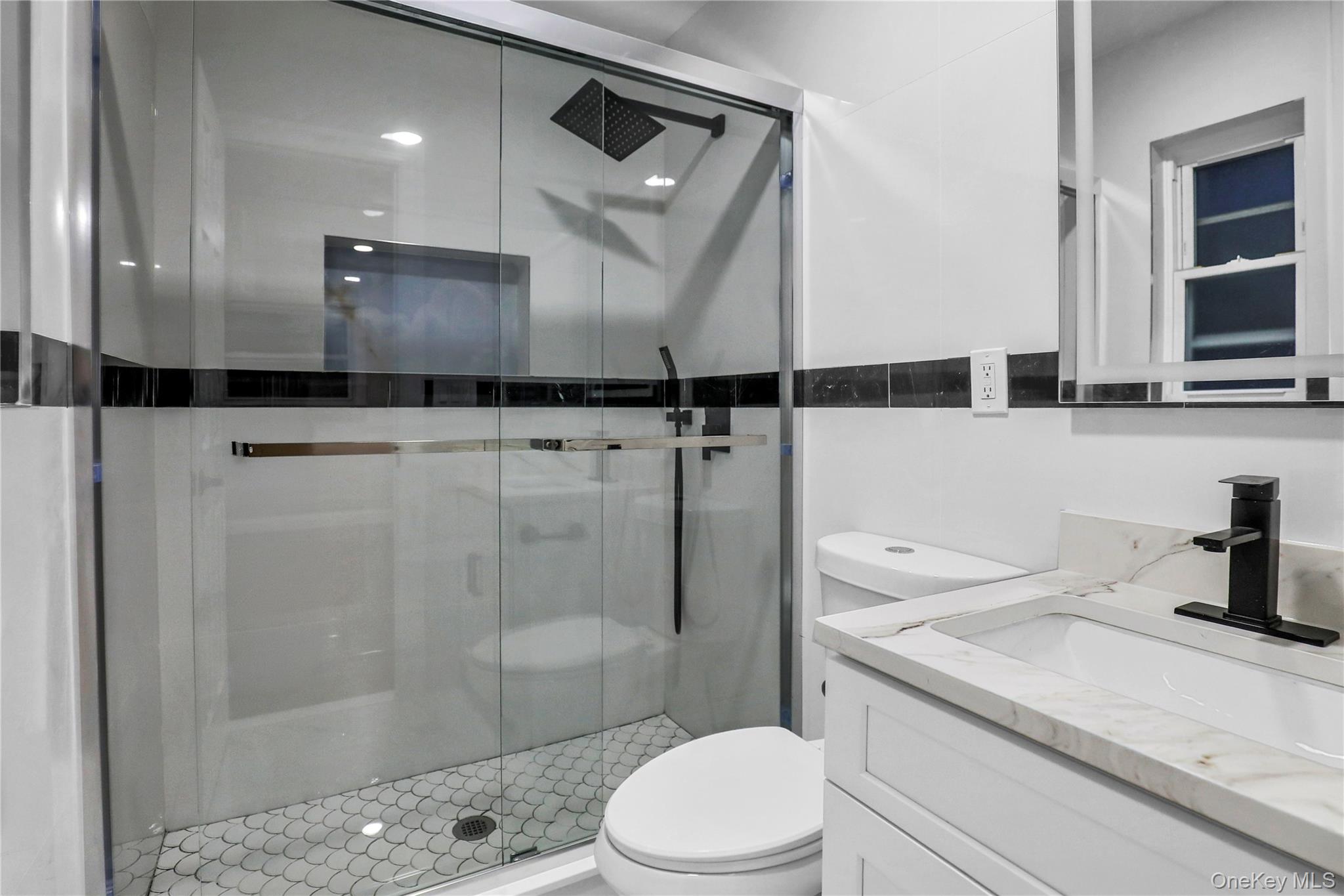 45 Colony Lane Syosset, NY 11791 - Photo 11 of 23 a bathroom with a sink a toilet and shower