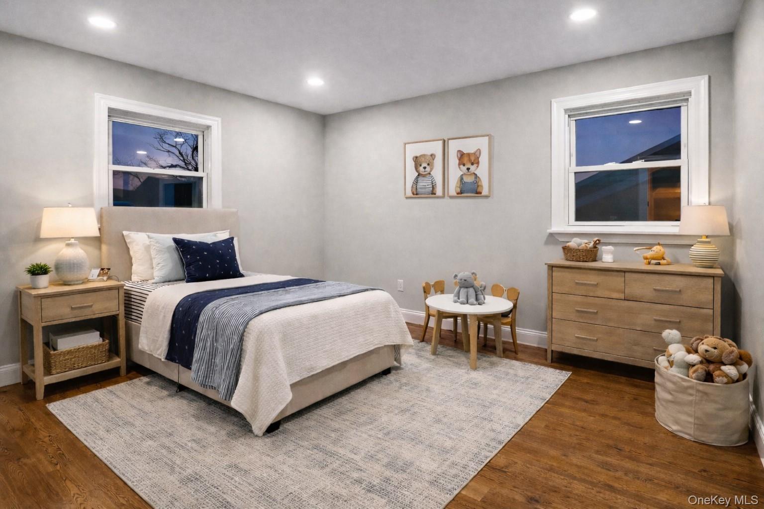 45 Colony Lane Syosset, NY 11791 - Photo 12 of 23 a bedroom with a bed and a flat screen tv