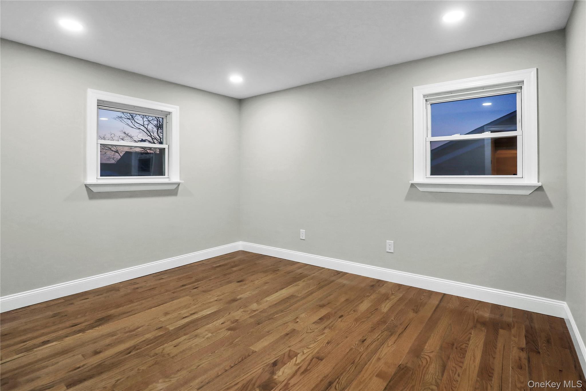 45 Colony Lane Syosset, NY 11791 - Photo 13 of 23 a view of a room with wooden floor and window