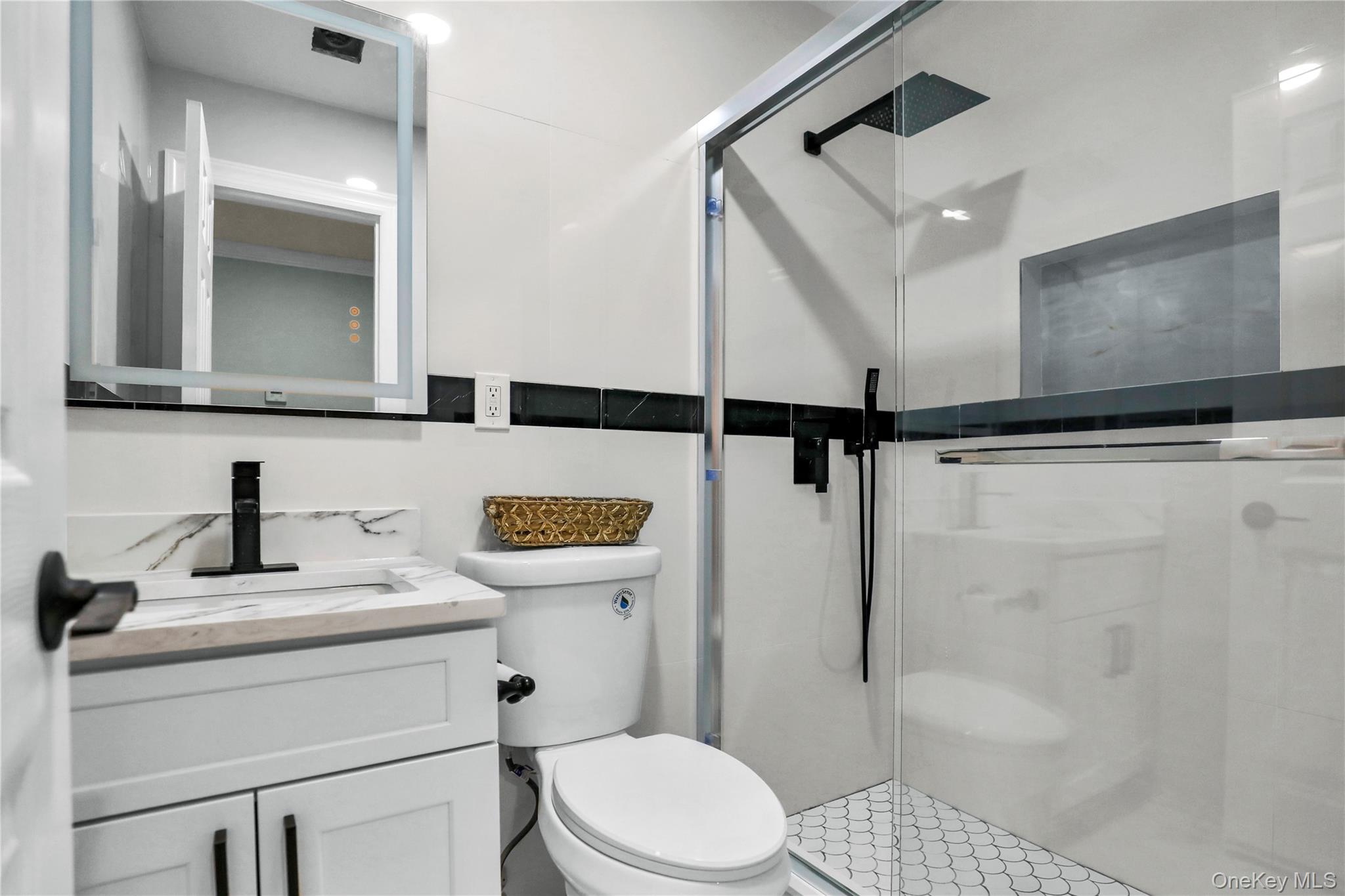 45 Colony Lane Syosset, NY 11791 - Photo 16 of 23 a bathroom with a sink a toilet and shower