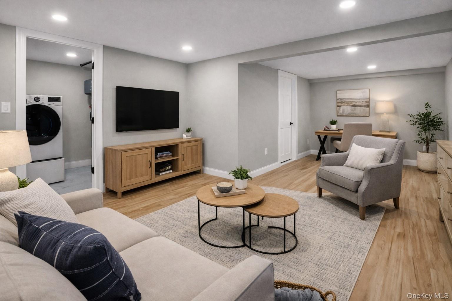 45 Colony Lane Syosset, NY 11791 - Photo 17 of 23 a living room with furniture and a flat screen tv