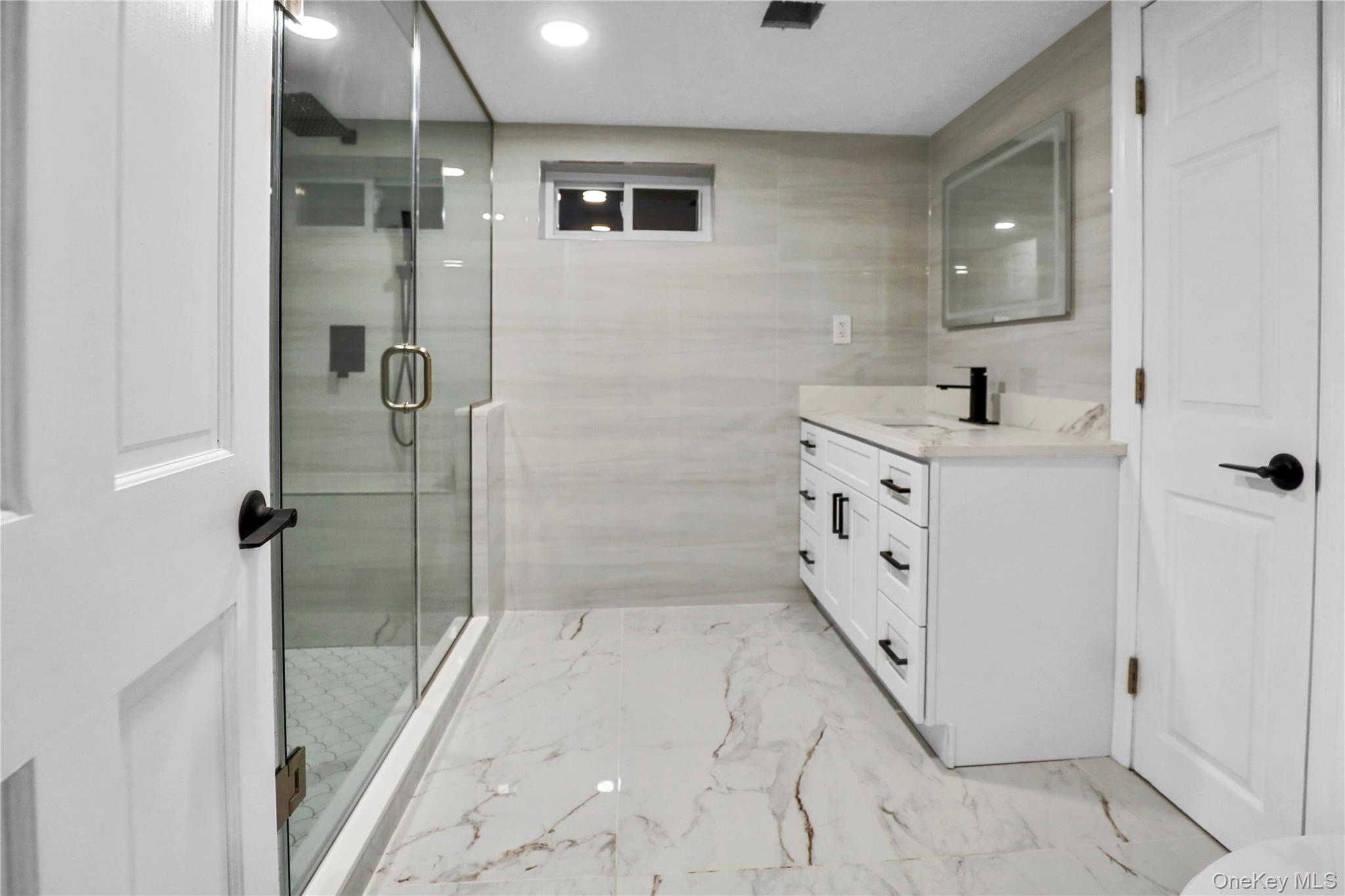 45 Colony Lane Syosset, NY 11791 - Photo 19 of 23 a bathroom with a double vanity sink toilet and shower